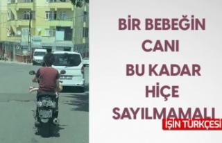 Sürücünün kucağındaki bebekle tehlikeli yolculuğu